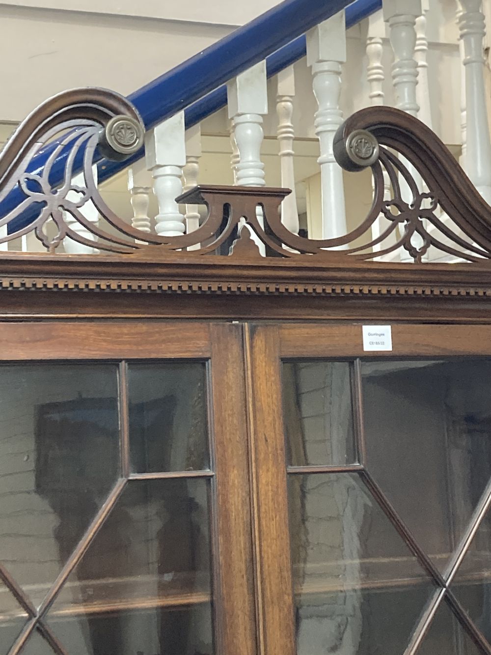 A George III style mahogany two door glass china display cabinet, with two panelled doors beneath, width 110cm depth 47cm height 220cm
